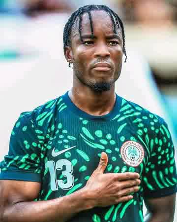 Bruno Onyemaechi celebrating the birth of his daughter Adanna with his newborn baby