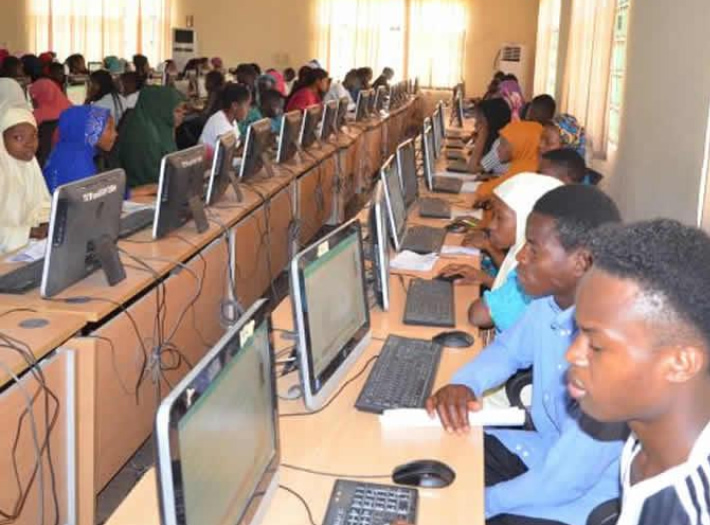 Female student wearing hijab at CBT exam centre in Nigeria