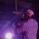 African China performing live on stage during a concert