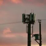 Mobile phone user checking airtime and data services in Nigeria
