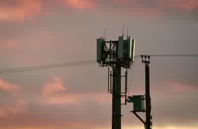 Mobile phone user checking airtime and data services in Nigeria