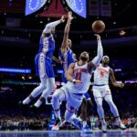 76ers vs Knicks NBA game action showing players battling for possession in a high-intensity Eastern Conference matchup