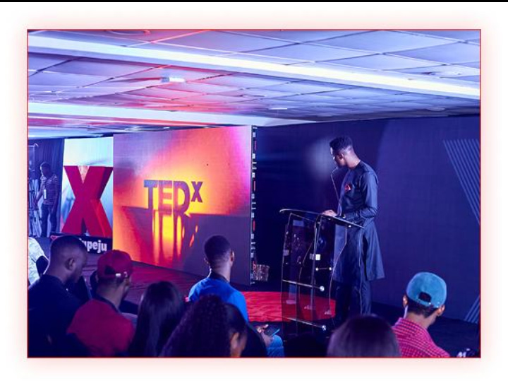 Boluwatife Balogun Champz delivering confident TEDx speech at Grange School Lagos event
