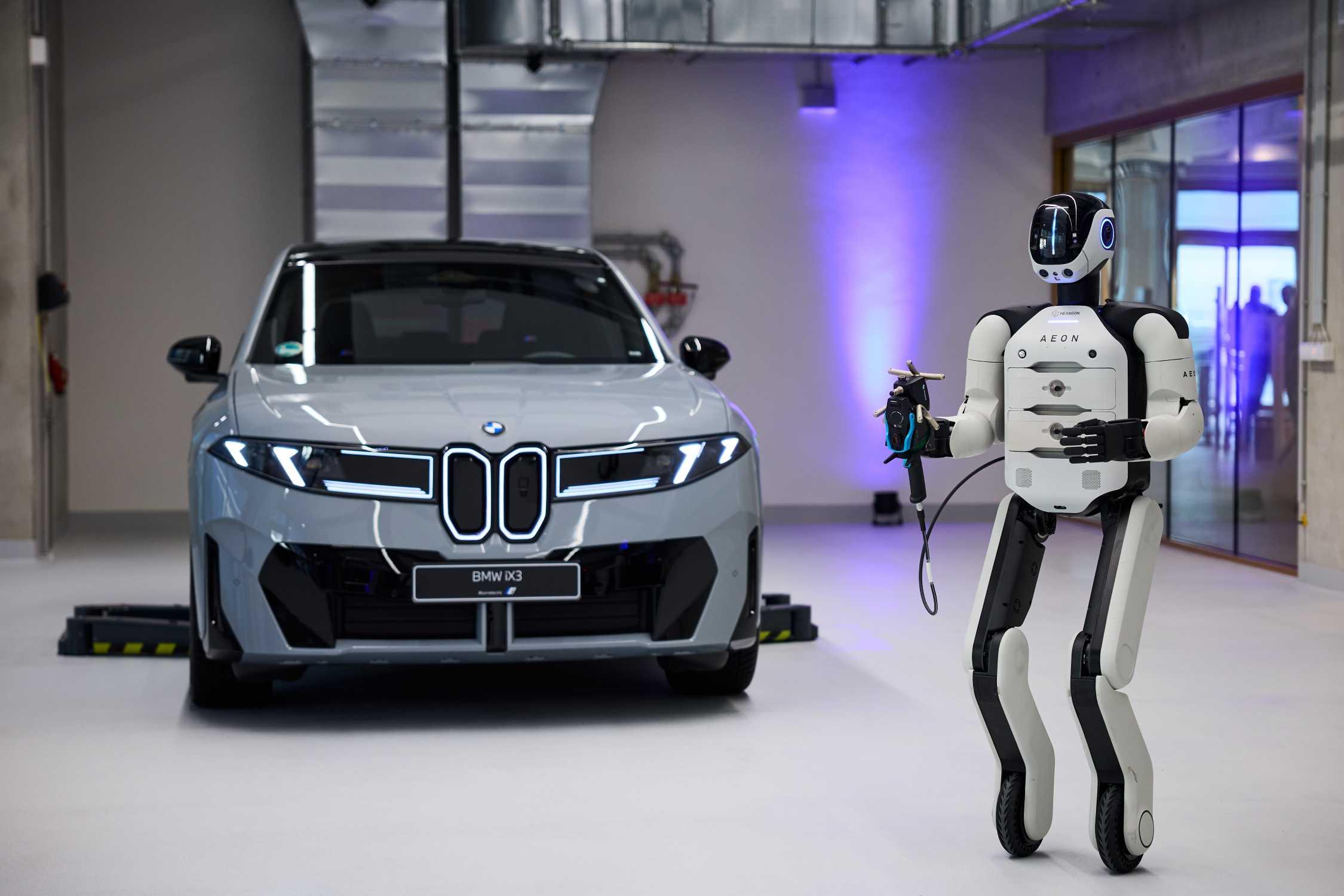 Humanoid robot working inside BMW car manufacturing factory in Europe