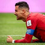 Cristiano Ronaldo playing for Portugal while Paul Scholes discusses his World Cup role