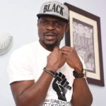 Nigerian actor Baba Ijesha celebrating family news.