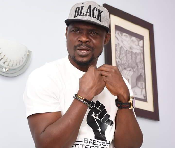 Nigerian actor Baba Ijesha celebrating family news.