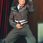 Janet Jackson performing on stage during a live music concert.