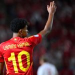 Lamine Yamal playing football for Barcelona and Spain.