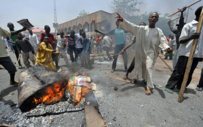 Residents in Nasarawa burning Governor Abdullahi Sule campaign posters and APC brooms during protest