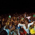 Nigerian rapper performing during a live music show.