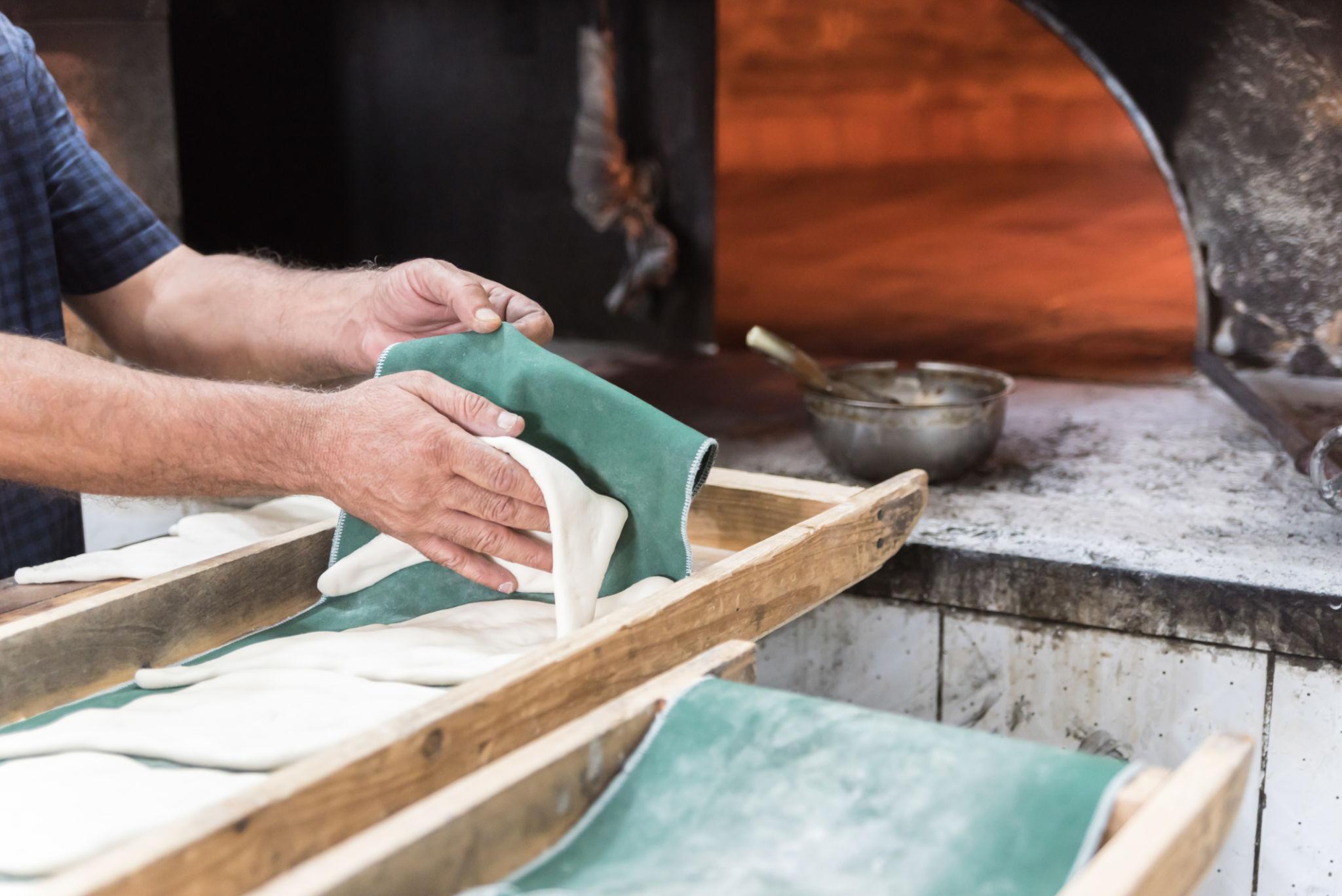 Padeiro baker preparing traditional Portuguese bread