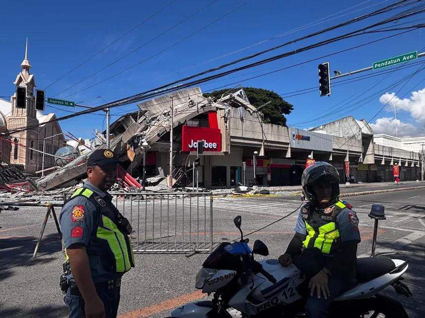 Emergency responders and residents after a powerful earthquake struck Mindanao in the Philippines.