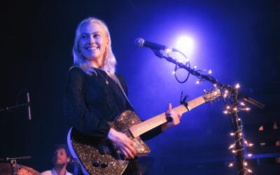 Phoebe Bridgers performing live during concert after announcing 2026 Lost Tour
