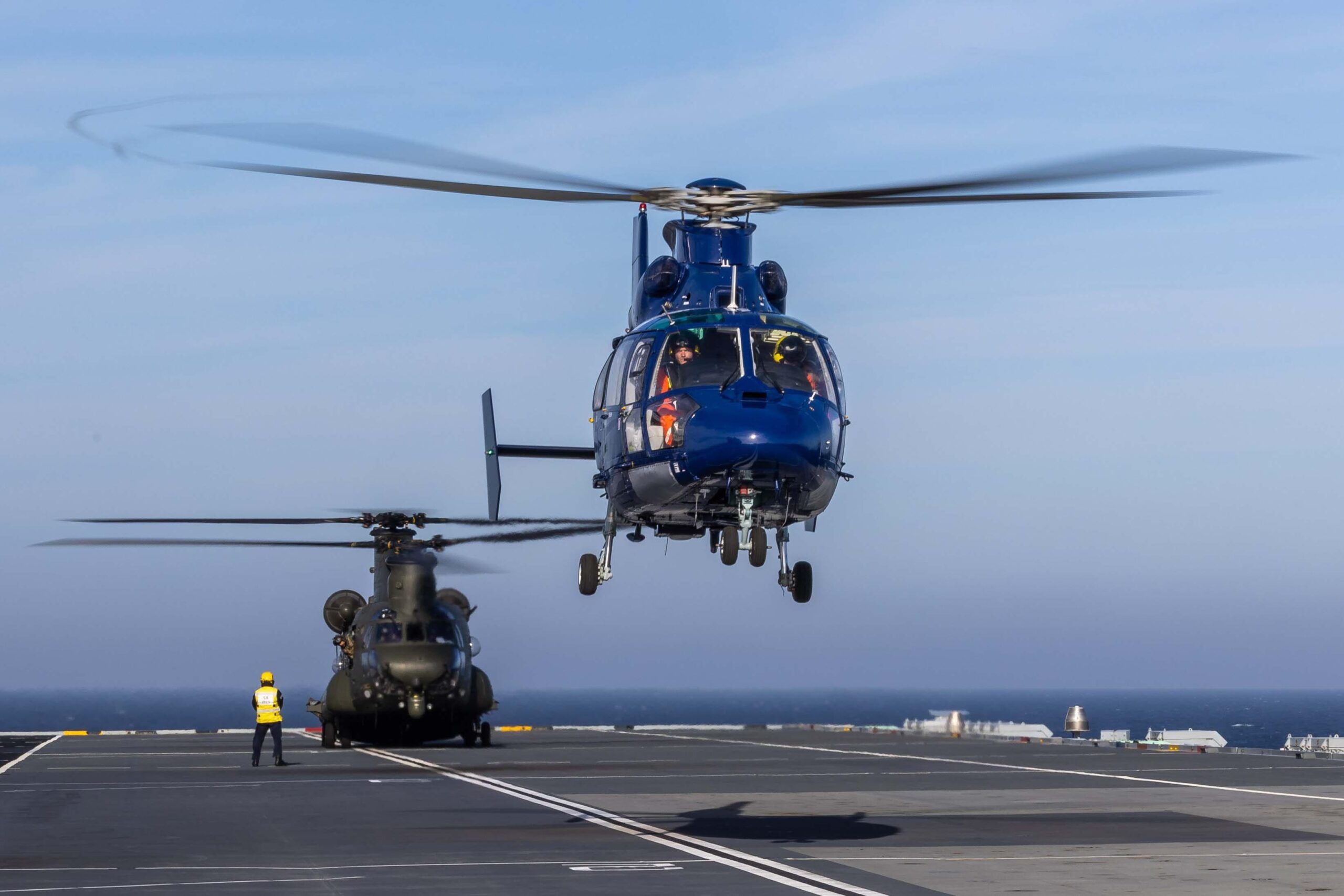 Emergency services respond after a Royal Navy helicopter crash in Devon.
